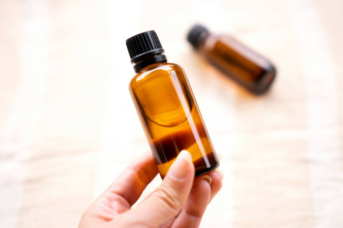 Woman holding Health Products anti-aging supplements next to skincare items